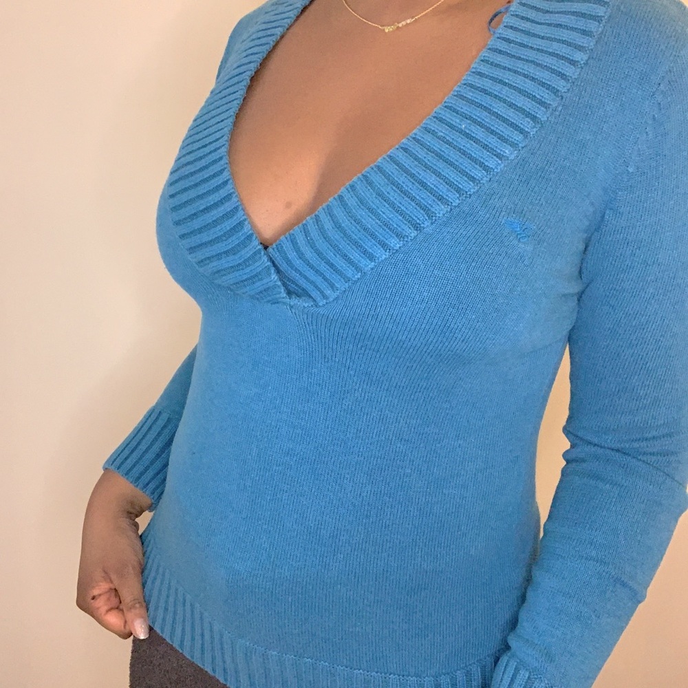 Blue V-neck sweater